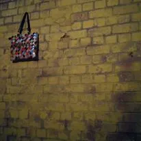 Dark, blurred photograph of light painting — streaks of white, blue, and gold light appear to explode or burst outward against a dark golden-brown background, evoking raw energy or emotional release. A row of illustrated frustrated figures borders the top and bottom. Post title is overlaid at the bottom left.